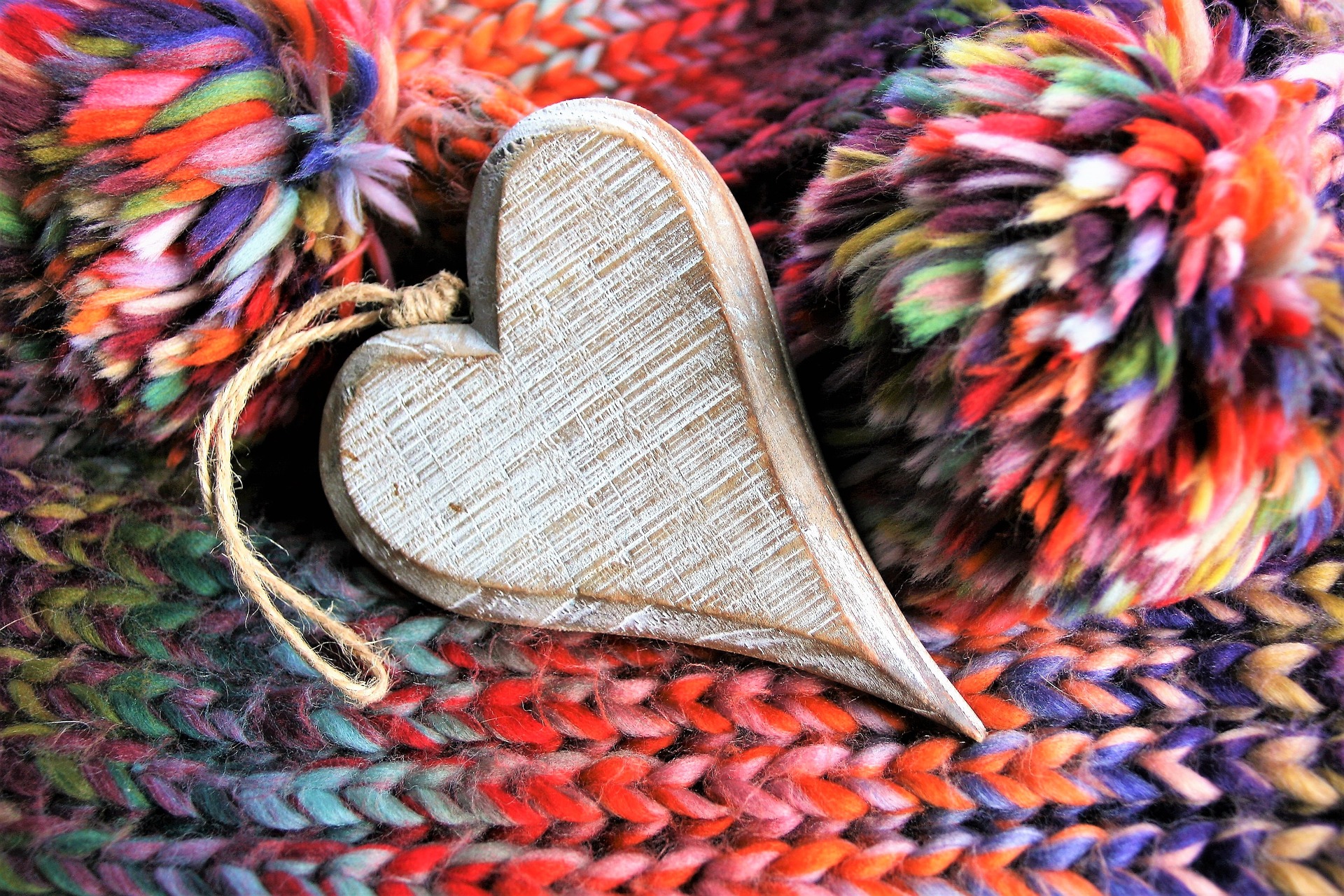A wooden heart on a scarf