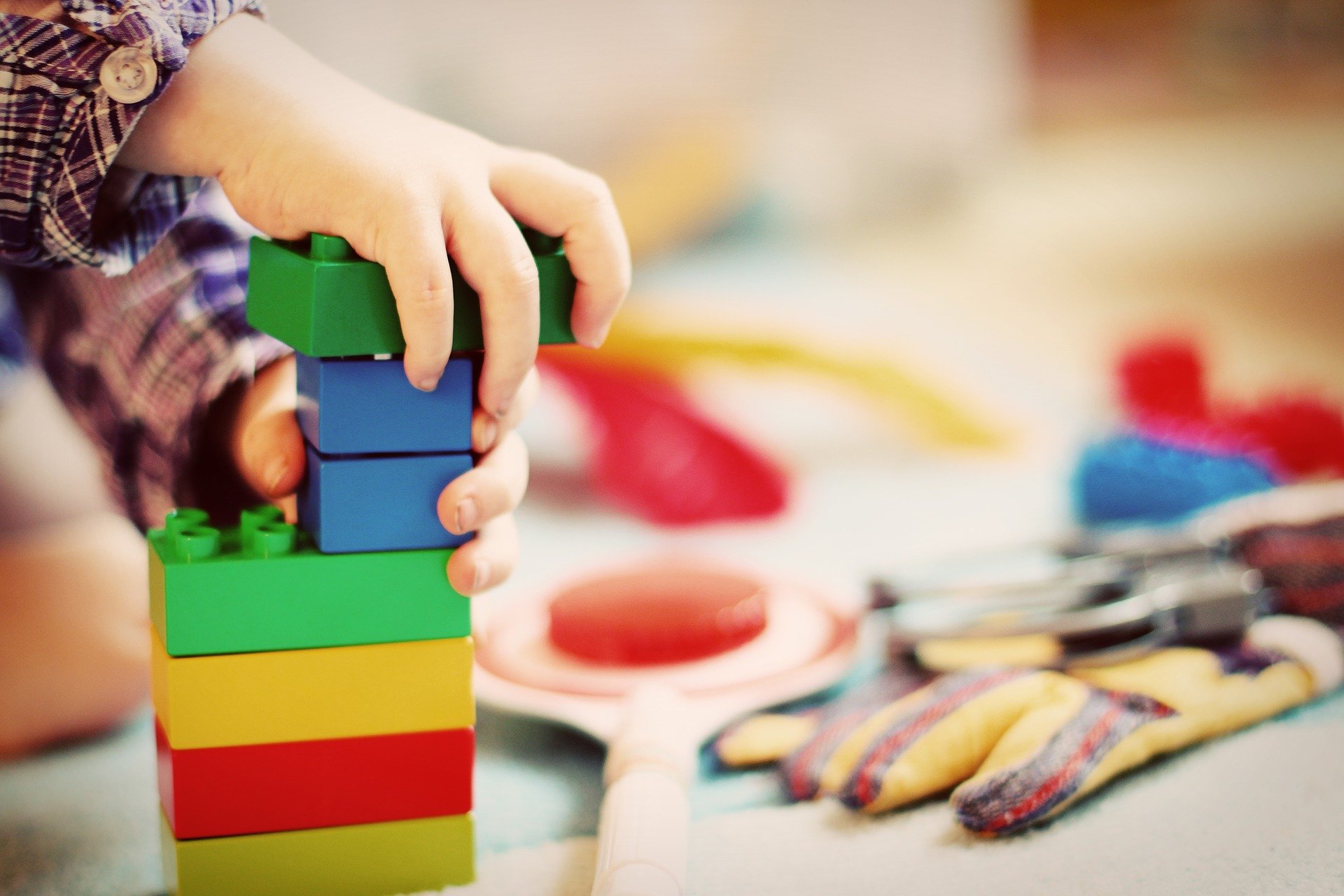 Toddler playing with lego